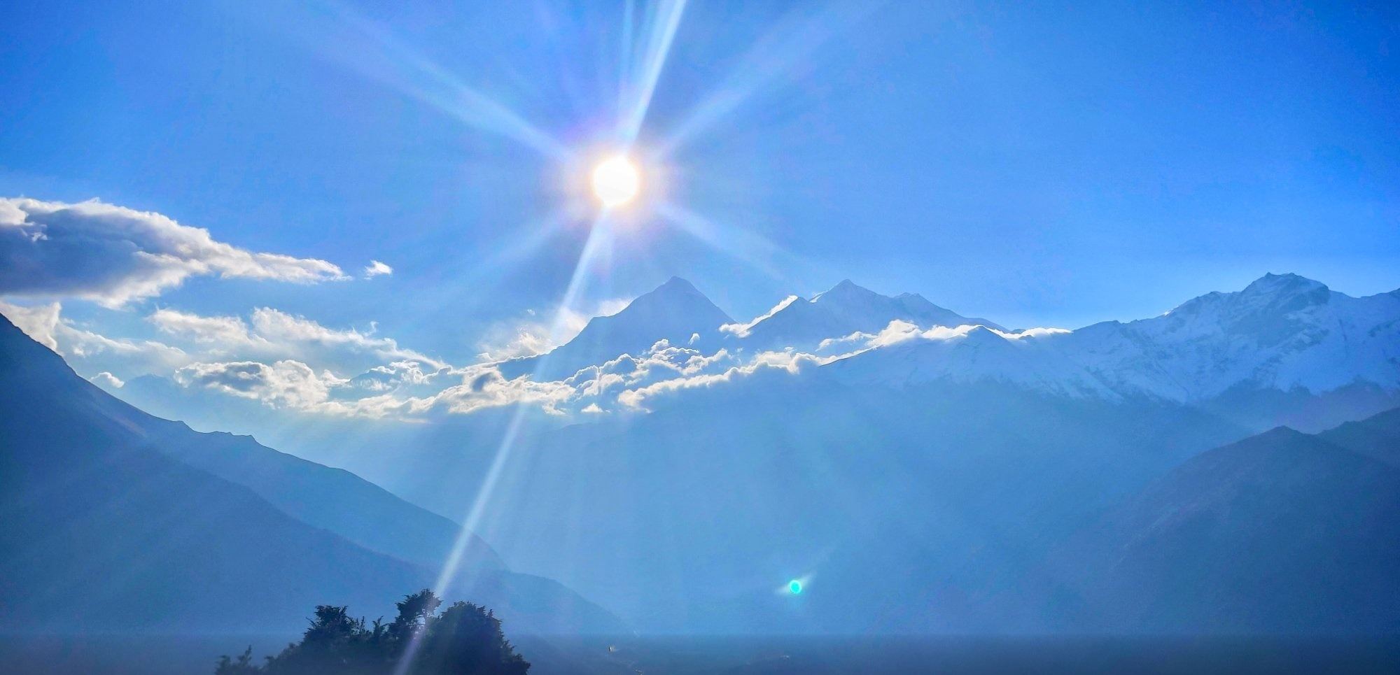 Morning sun above the snow peaks of the Annapurna range